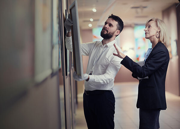 Man and woman at a note board planning strategy development