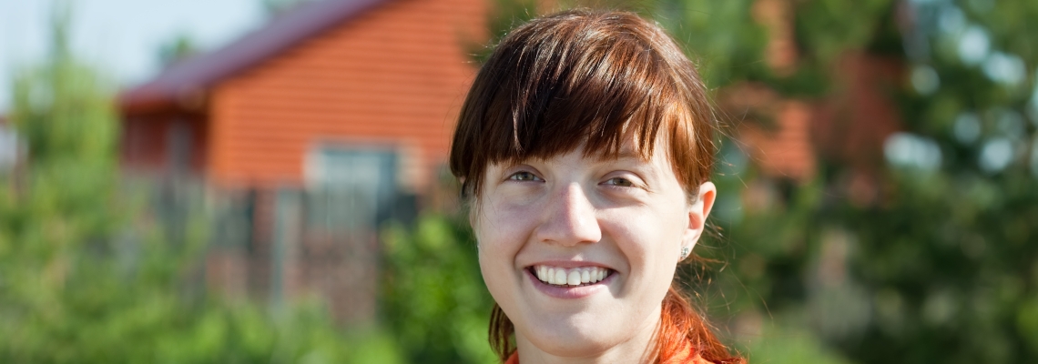Community Development woman with bangs looking at the camera