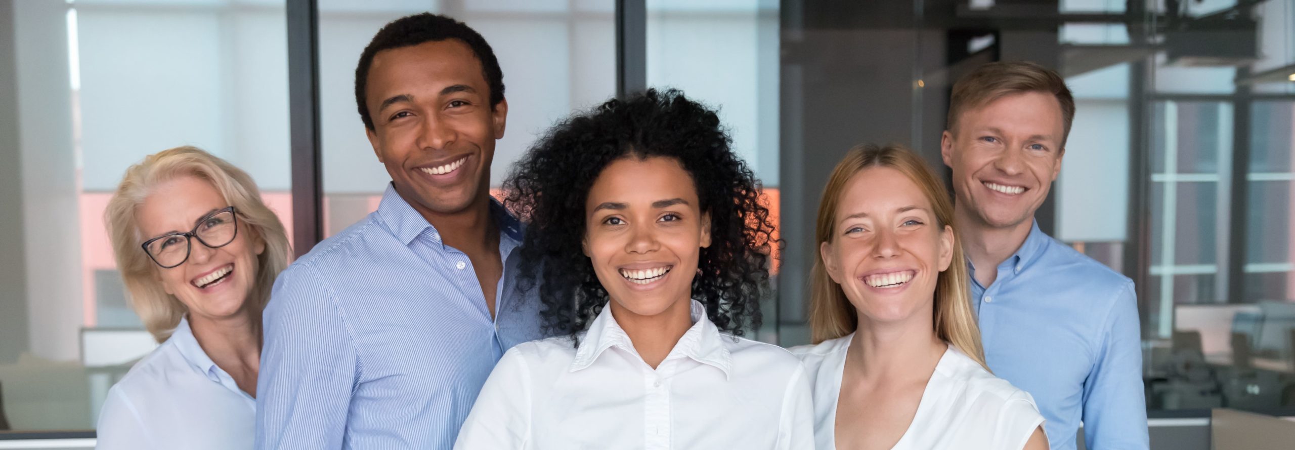 group of five people smiling at camera OTEC education